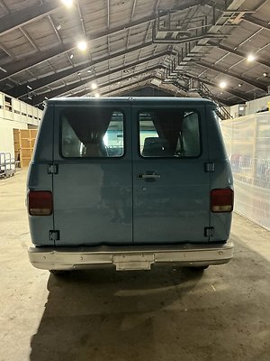 C. BLUE CHEVY VAN BACK SIDE