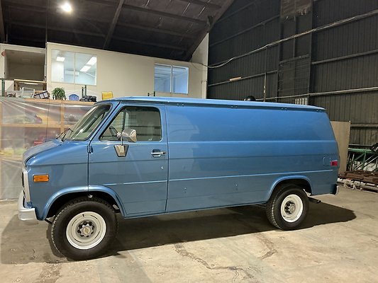 B. BLUE CHEVY VAN LFT SIDE