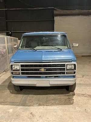 A. BLUE CHEVY VAN FRONT